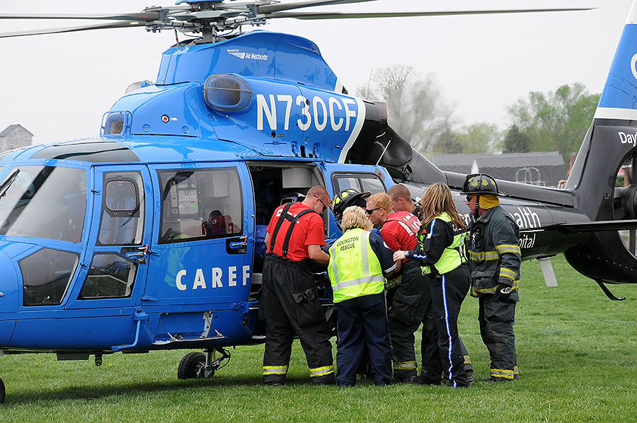 first responders loading a person into a medical helicopter