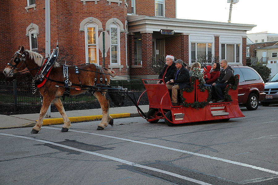people in a horse drawn carriage
