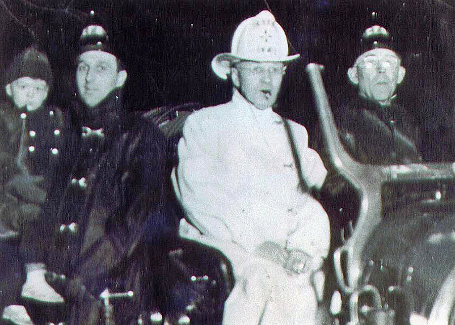 black and white photo of a group of firemen in the 1930s