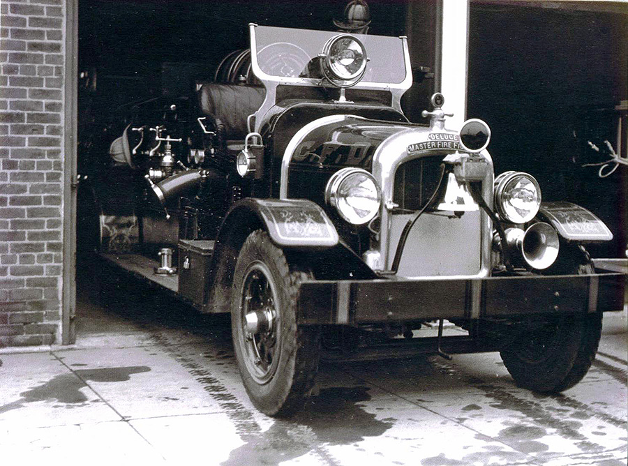 black and white photo of a firetruck