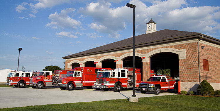 fire house with firetrucks