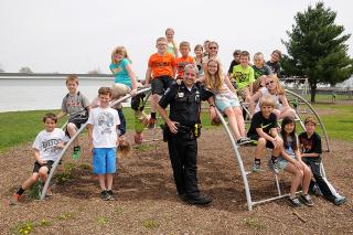 Police Officer with kids on playground